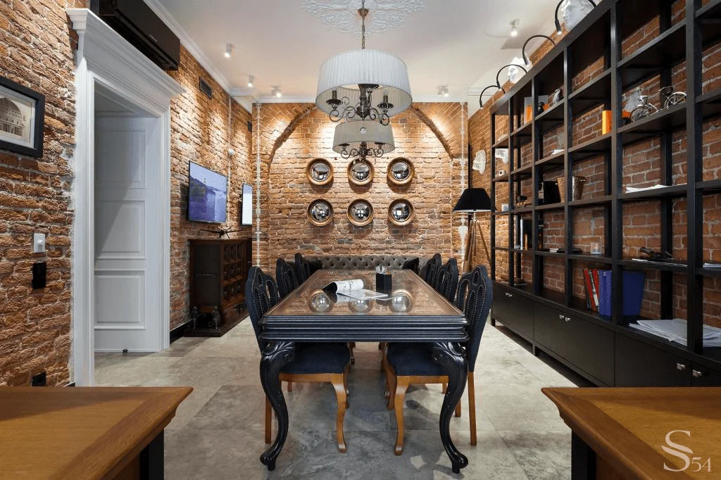 The relief of brick loft walls is emphasized by backlighting