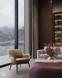 Poltrona Frau leather armchair in the relaxation zone overlooking the mountain lake