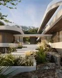 Transparent entrance hall that unites main and guest wings